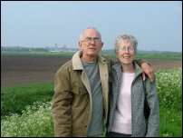 My parents, Ely Cathedral in the distance.